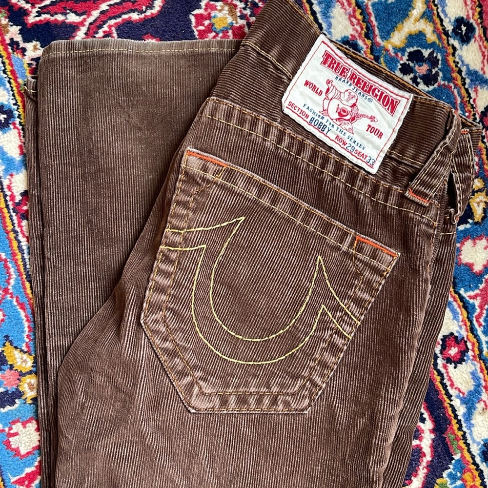 TRUE RELIGION “BOBBY” ROW 29 SEAT 33